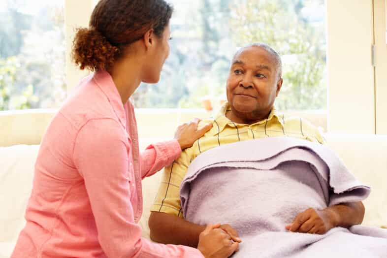 Woman Caring For an Elderly Man